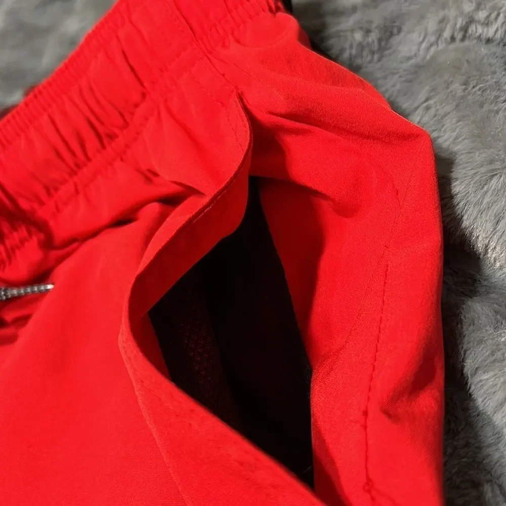 Nike  Red and Black Swim Trunks (Men's Size Medium)
